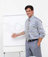 Self-assured businessman pointing at a board