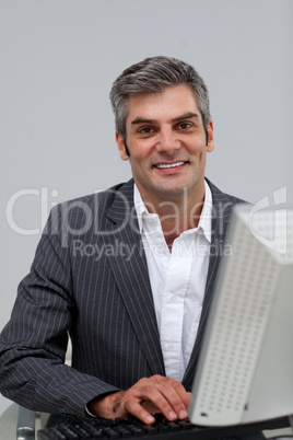 male executive working at a computer