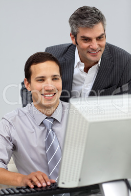 Two smiling businessmen working