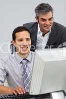 Two smiling businessmen working