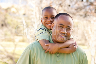 African American Man and Child Having Fun
