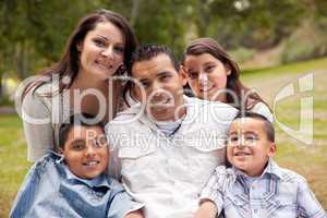 Happy Hispanic Family In the Park