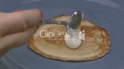 Pancake with sour cream.