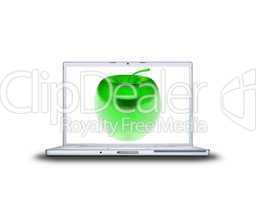 3D green glass apple on laptop