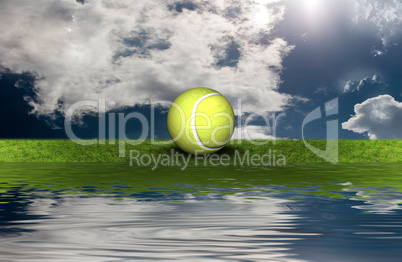 tennis ball on the green grass with sky background