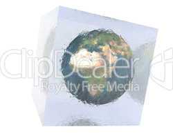 earth in cracked glass cube with reflection on white