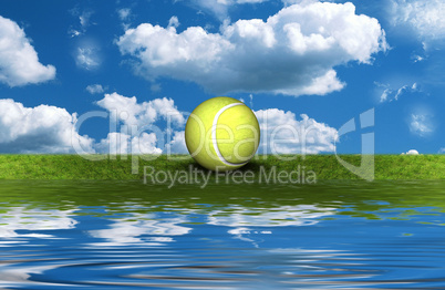 tennis ball on the green grass with sky background
