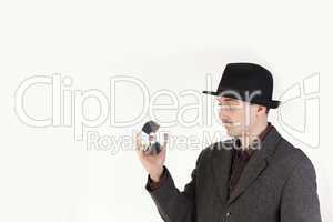 Man in hat holding a compact disc