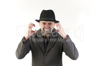Man in hat biting a compact disc