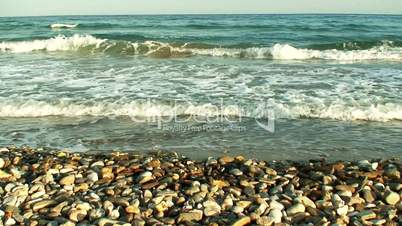 Waves washing onto pebble beach 1