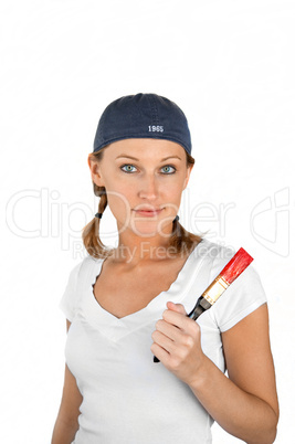 Beautiful girl on white holding paint brush with red paint