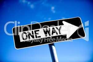 One Way Sign with blue sky