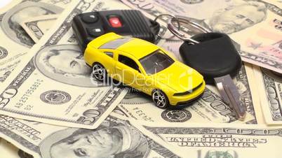 Geldscheine und Modellauto