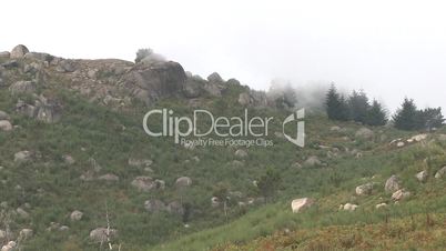 Fog rolling down in mountain time lapse