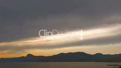 HD panorama of sea and rocks at sunset with clouds