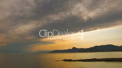 HD sea and rocks at sunset with clouds