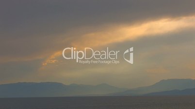 HD sea and rocks at sunset with clouds wide