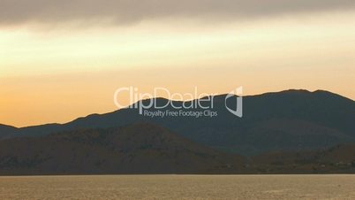 HD panorama of sea and rocks at sunset with clouds