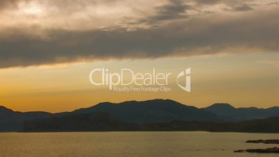 HD panorama of sea and rocks at sunset with clouds