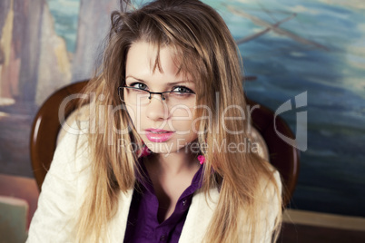 Portrait of a Sexy blond girl with glasses
