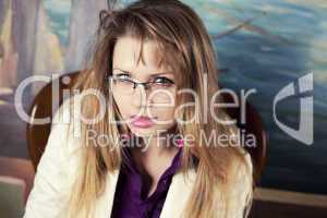 Portrait of a Sexy blond girl with glasses