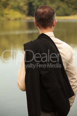 man with jacket at the shore