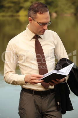 businessman looking in his diary