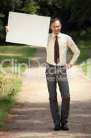 businessman holding blank board