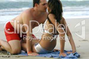 Couple kissing at the beach