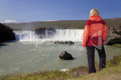 Woman Hiker At Godafoss Waterfall, Iceland