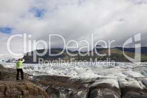 Woman Hiker Looking Across The Vatnajokull Glacier Iceland