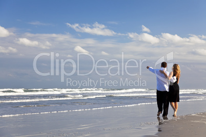 Man and Woman Couple Having Romantic Walk On A Beach