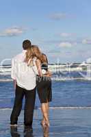 Man and Woman Couple In Romantic Embrace On Beach