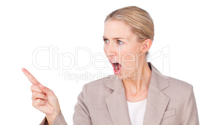 Angry blond businesswoman pointing