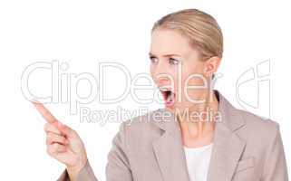 Angry blond businesswoman pointing