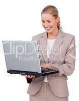 Charismatic businesswoman using a laptop