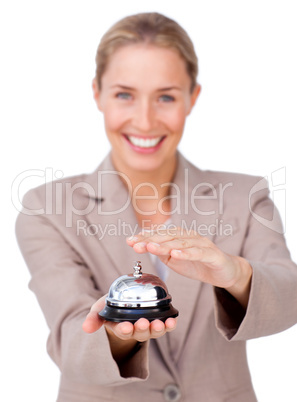 Smiling businesswoman holding a service bell