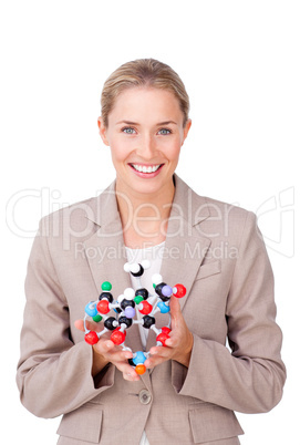 Smiling businesswoman holding a molecule