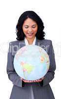 Confident ethnic businesswoman smiling at global business