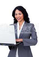 Cheerful businesswoman using a laptop