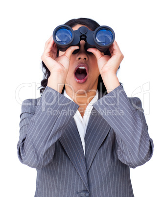 Astonished businesswoman looking through binoculars
