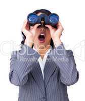 Astonished businesswoman looking through binoculars