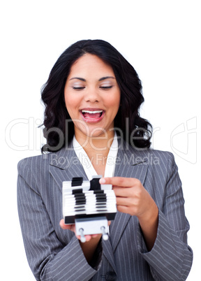 Enthusiastic businesswoman consulting a business card holder