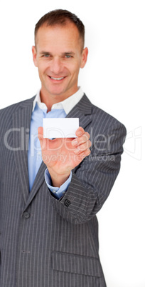 Smiling assertive businessman showing a white card