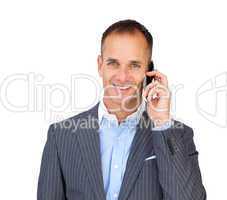 Assertive businessman using a mobile phone