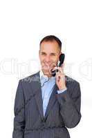 Smiling businessman tangled up in phone wires