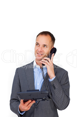 Positive businessman talking on a phone