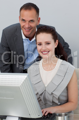 Business partners at a computer