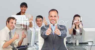 Assertive manager and his team with thumbs up