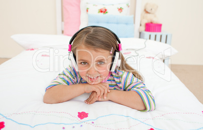 Cute little gril listening to music